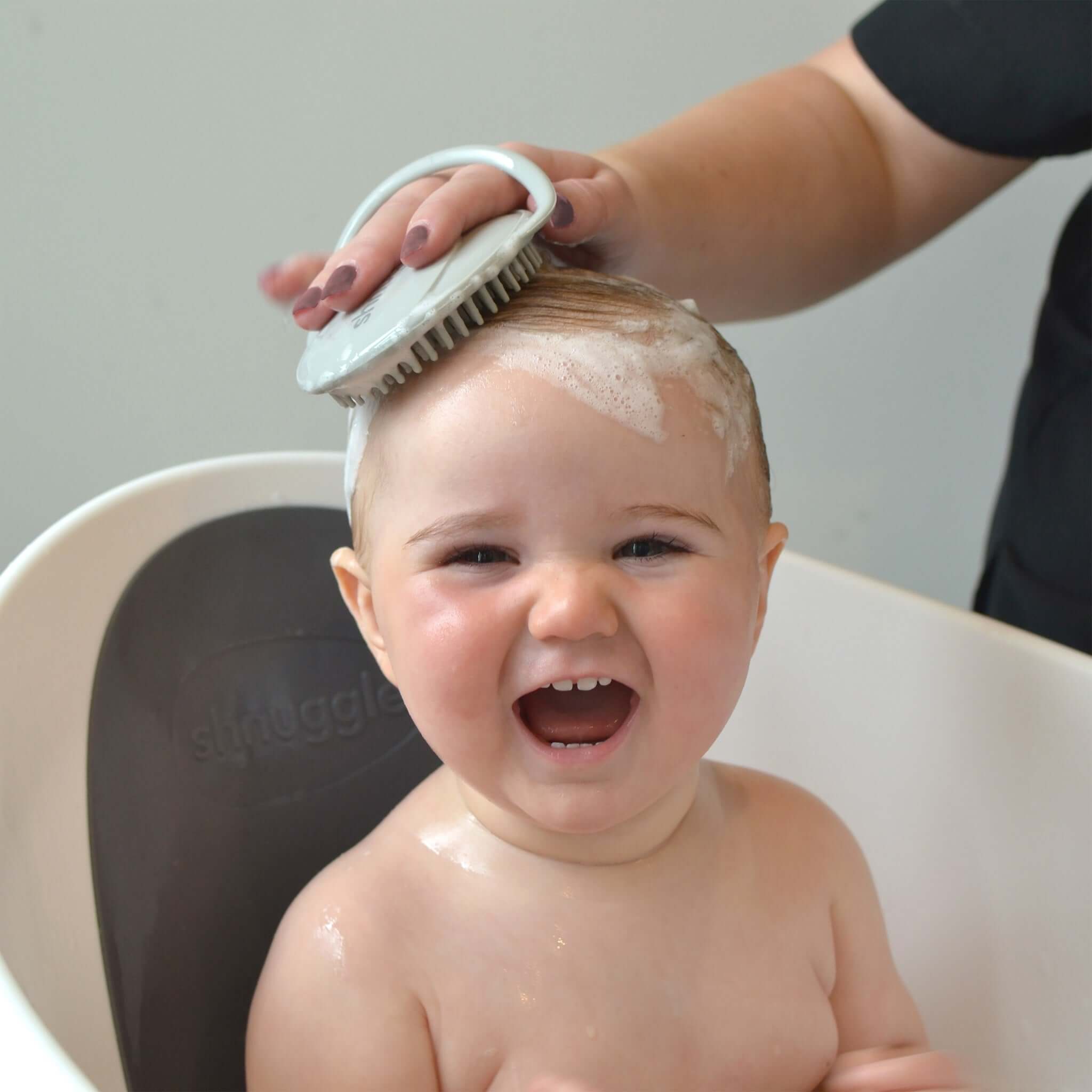 Bath brush used on baby