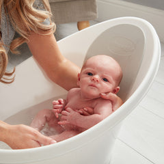 Baby in white Shnuggle Baby bath